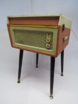 A mid 20th Century Dansette Bermuda record player with Monarch turntable, raised on round tapering