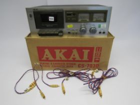 A boxed Akai CS-703D stereo cassette deck with four Kimber Kable RCA cables