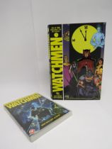 The Watchmen hardback graphic novel, signed by Alan Moore and Dave Gibbons with Moore adding "Who