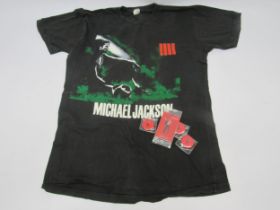 MICHAEL JACKSON: A 1988 'Bad' tour t-shirt together with three 2009 'This Is it' tour badges and