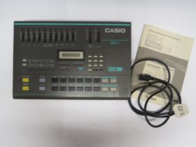 A Casio RZ-1 digital sampling rhythm composer drum machine with manual and power lead