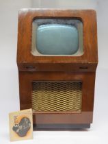 A Pye type FV1 console television, the 12" screen above a mesh speaker grille housed in walnut