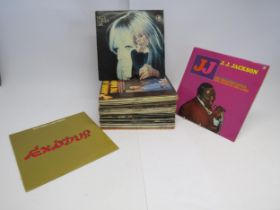 A box of mixed LPs including Nico, Stevie Wonder, Chuck Berry, The Beatles, Carl Perkins, Wings,