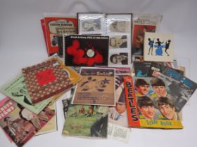 A collection of assorted film and music ephemera including film star photocards, Beatles scrapbook