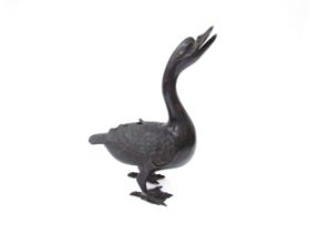 A Japanese Meiji period archaic style bronze ‘duck’ censer and cover, 35cm tall