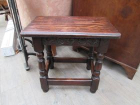 A 19th Century revival oak joint stool, the chip carved seat over a carved frieze on turned square
