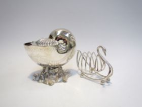 A Walker & Hall silver plated spoon warmer as a shell upon a rocky naturalistic base, together