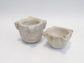 Two carved marble mortars, 8.35cm and 12cm tall