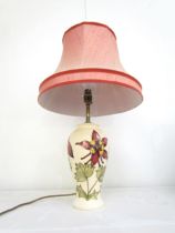 A Moorcroft Aquilegia pattern table lamp, cream ground