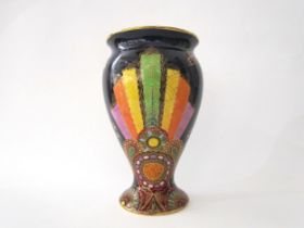 A Carlton Ware lustre vase with Art Deco styling, blue ground with multicoloured patterns,