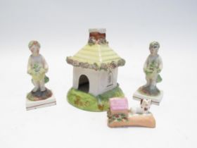 A Victorian Staffordshire cottage pastille burner, two early 19th Century Staffordshire figures of