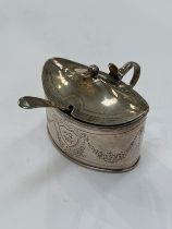 An Alexander Field silver mustard pot, chased foliate swags and central dragon and crown