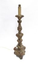 An 19th Century gilded wood pricket candlesticks converted to electricity with weighted lead to