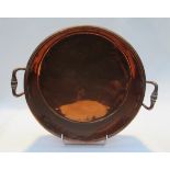 A copper twin handled circular pan, 40cm diameter