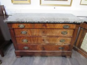 A 19th Century French flame mahogany commode with marble top, the four long drawers with embossed