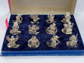 A set of 12 Sterling silver Thai name place holders, all decorated with deities in fitted Jewels