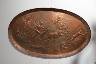 A circa 1900 copper oval tray of large proportions, repousse Romanesque chariot scene, 106cm x 63.
