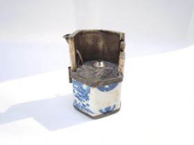 A Chinese Guangxu opium pot and pipe, white metal frame with blue and white dragon ceramic body, six