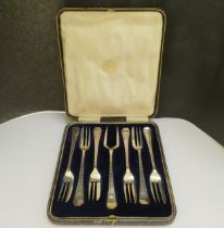 A Lee & Wigfull (Henry Wigfull) silver set of six cake forks with serving fork, cased, Sheffield