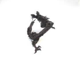 A bronze figure of an Oriental dragon, 13.5cm tall