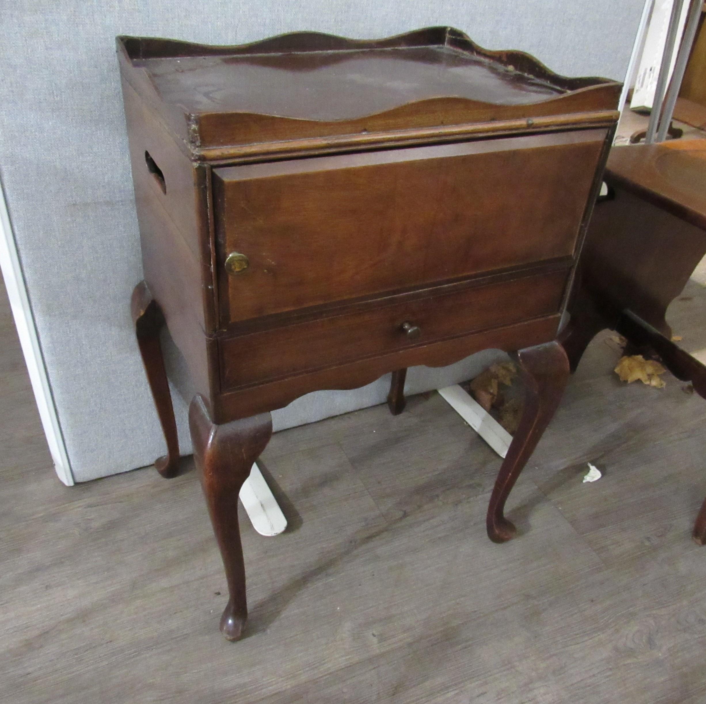 A late 19th Century mahogany night-table with galleried top above cupboard and drawer, raised on