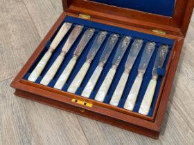 A Victorian Atkin Brothers 24 piece mother-of-pearl and silver fish knife and fork set, Sheffield