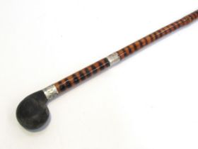 An early 20th Century bamboo encased sword stick with ebonised handle, total length 87cm