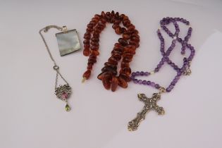 A paste necklace, two bead necklaces one with cross and a pendant
