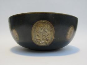 A papier mache bowl decorated with modern cameo style prints, 11.5 cm x 26.5 cm diameter
