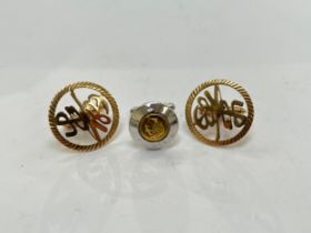 A pair of 14k gold cufflinks with Chinese symbol detail, (10g) and a single silver Queen Elizabeth