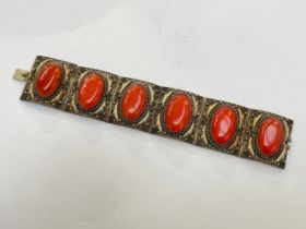 A Chinese panel bracelet with cabochon set stones, stamped silver China, 18cm long