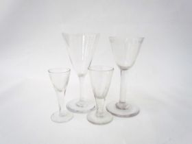 Two wine glasses one with cut glass band to rim, 16cm tall. A similar example with cut glass stem,