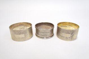A cased pair of R.N. Holling & Co, silver napkin rings, Birmingham 1944 and another silver