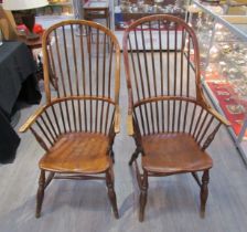 A pair of circa 1800 his and hers Windsor chairs, the hoop and stick-back over a solid elm seat,