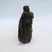 A 16th Century Elizabethan period oak secular figure, probably female wearing a cloak, 18.5cm