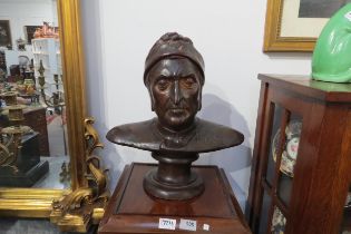 A terracotta bust of Dante with bronzed effect, 42cm tall