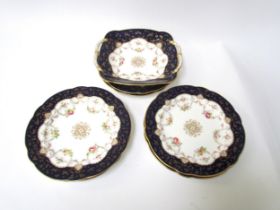 A late 19th / early 20th Century Coalport dessert set consisting of six plates and twin handle