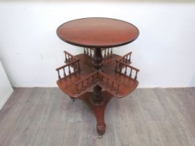 A mahogany revolving library / book table with galleried spindled shelving