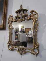 A Chippendale style mirror with later mirror plate, 66cm high