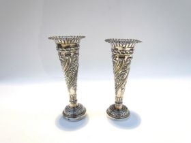 A near pair of silver embossed bud vases, 11g total
