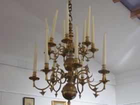 A brass two tier 12 sconce candelabra