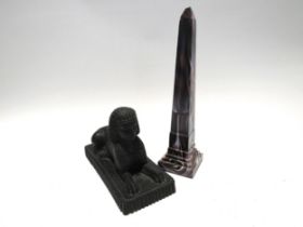 A Victorian slag glass obelisk, 28cm tall and Victorian moulded glass Sphinx with lozenge mark to