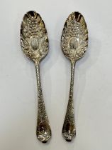 A pair of Ebenezer Coker silver berry spoons, London 1750, 152g
