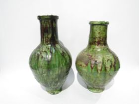 A near pair of French green drip glaze pottery vases, 37.5cm and 35cm high
