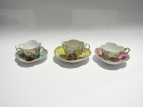 Three Continental cabinet cups and saucers