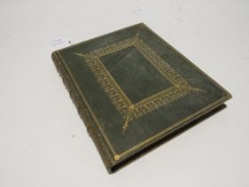 A 19th Century bound and gilded album containing written verse and pros, including handpainted image