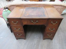 A 19th Century mahogany twin pedestal desk by S&H Jewell of Holborn, shell marquetry inlay and