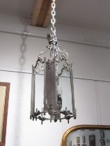 A hall lantern of large proportions with glass and chrome/silvered panels, four bulb, 67cm tall