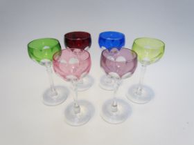 A set of six Harlequin Hock wine glasses with coloured overlay bowls