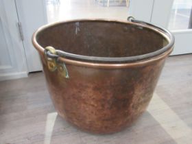 A large copper copper with wrought metal handle, 40cm tall x 59cm diameter